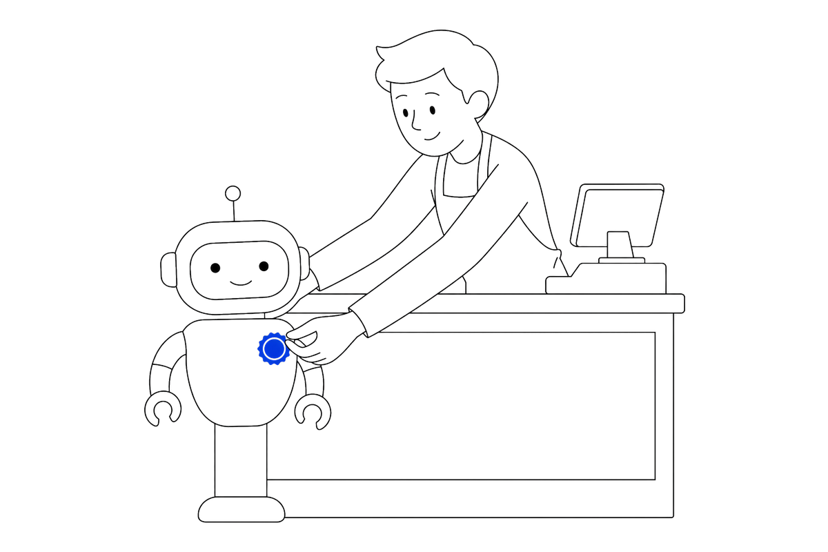 A person at a shop counter pins a badge onto a robot